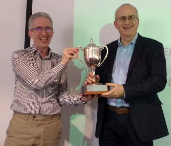 ACS president David Kendix hands the Brooke-Lambert Trophy to Statistician of the Year Jeremy Lonsdale